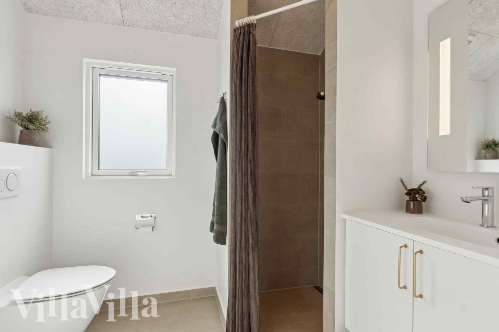 Eines der Badezimmer im Luxusferienhaus Nr. 997