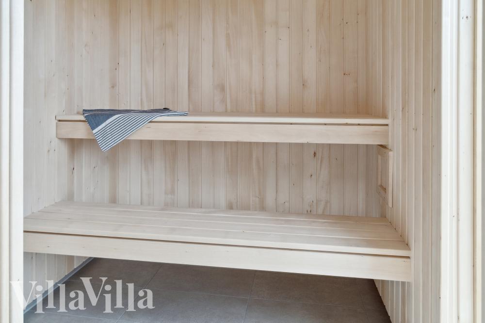 Genießen Sie die heiße Sauna im Luxusferienhaus Nr. 1026 für 14 Personen