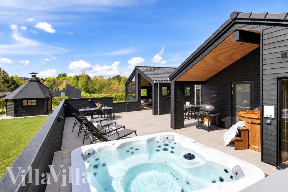 Diese schicke Haus mit Whirlpool Nr. 1027 mit Platz für 12 Personen liegt in Fünen und seine Inseln