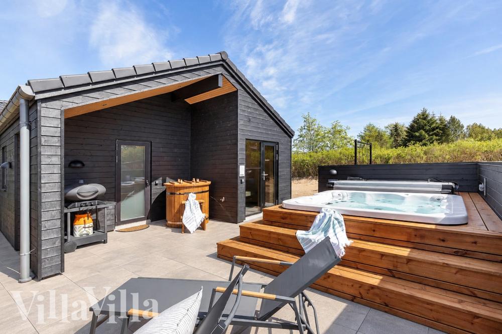 Genießen Sie den warmen Whirlpool im Luxusferienhaus Nr. 1027 in Fünen und seine Inseln